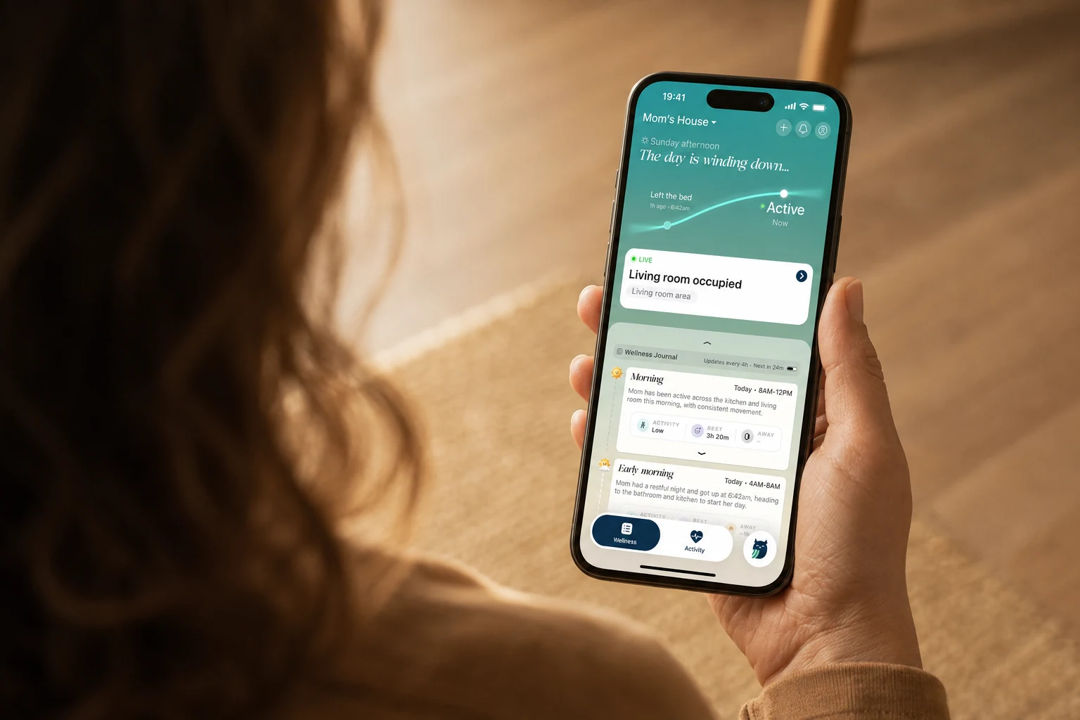 The Silvie app open in a hand, showing which room a parent is in