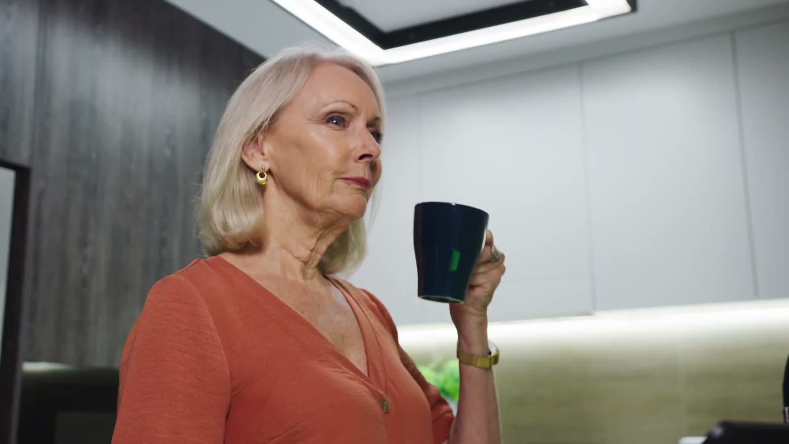 Adam's mom at home with her morning coffee