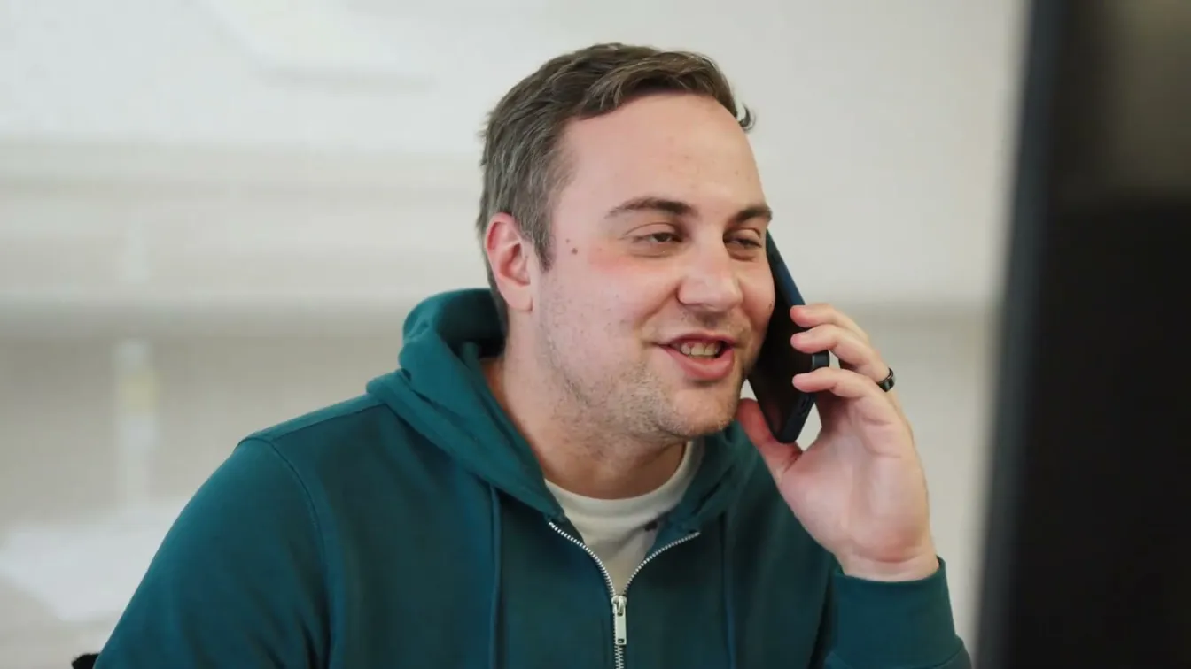 Adam on the phone, checking in